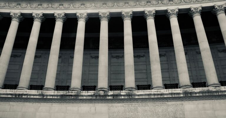 Detailed view of neoclassical columns in a government building facade.